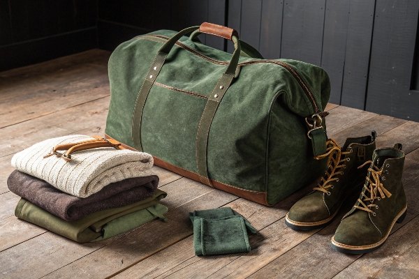 A large, durable corduroy duffle bag ready for a weekend trip.