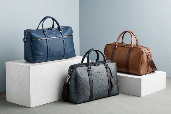 A collection of unbranded, stylish daily bags that have a designer aesthetic, displayed in a clean, minimalist setting.